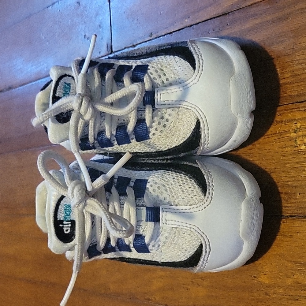 Toddler white, black, grey and blue Nike airmax sneakers.